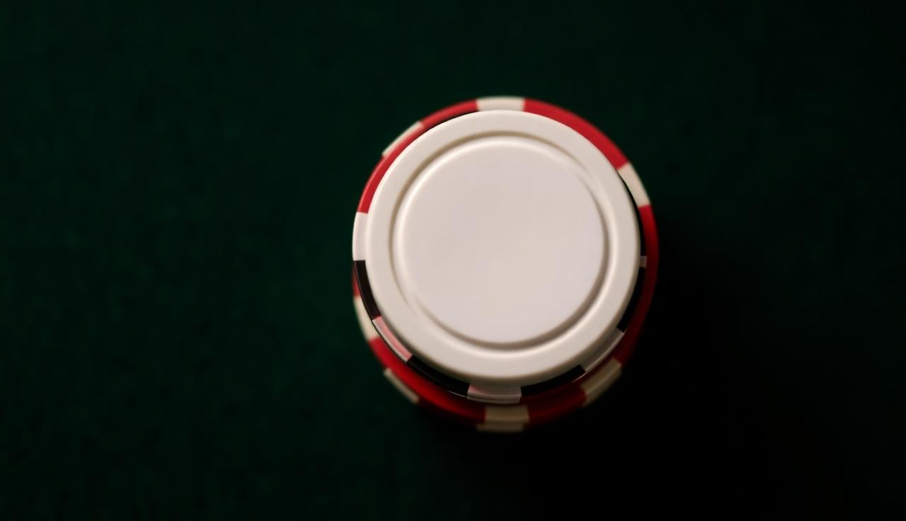 Top-down view of a dealer button on the felt